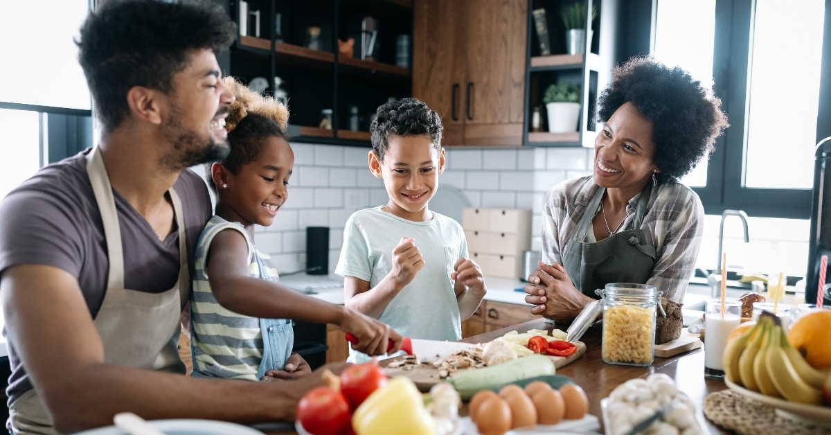 Happy family making dinner together