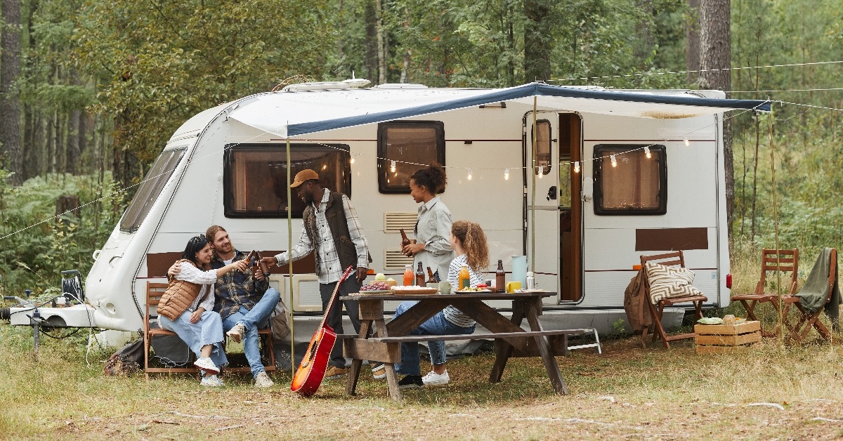 young people enjoying outdoors while camping