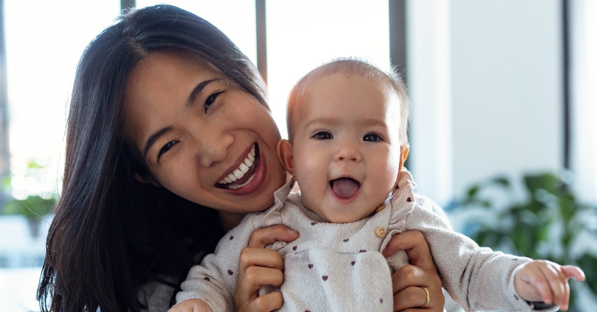 happy young mother with her baby daughter