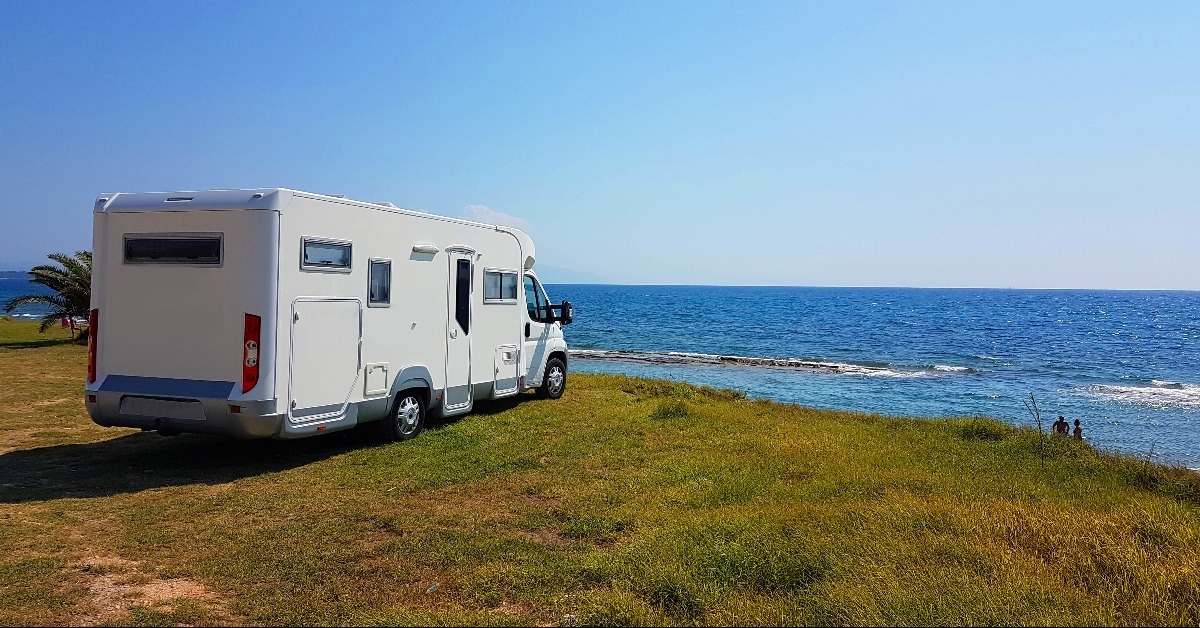 caravan trailer car by the sea in summer holidays