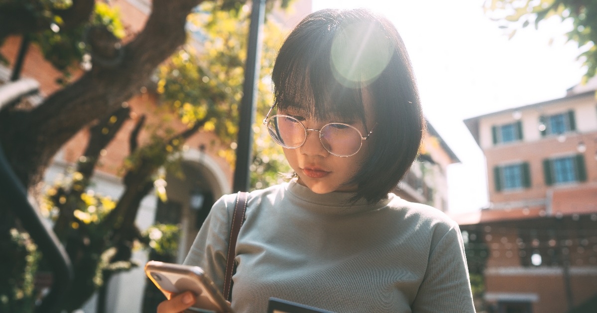 young asian woman using credit card and mobile phone