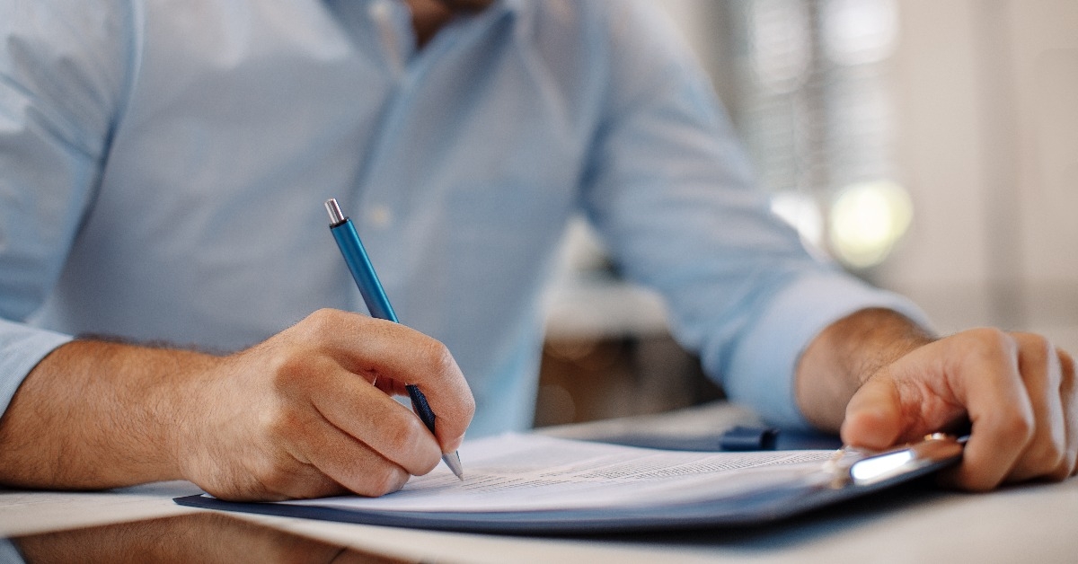 young businessman signing a contract