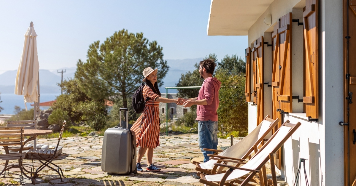 Airbnb host greeting guest
