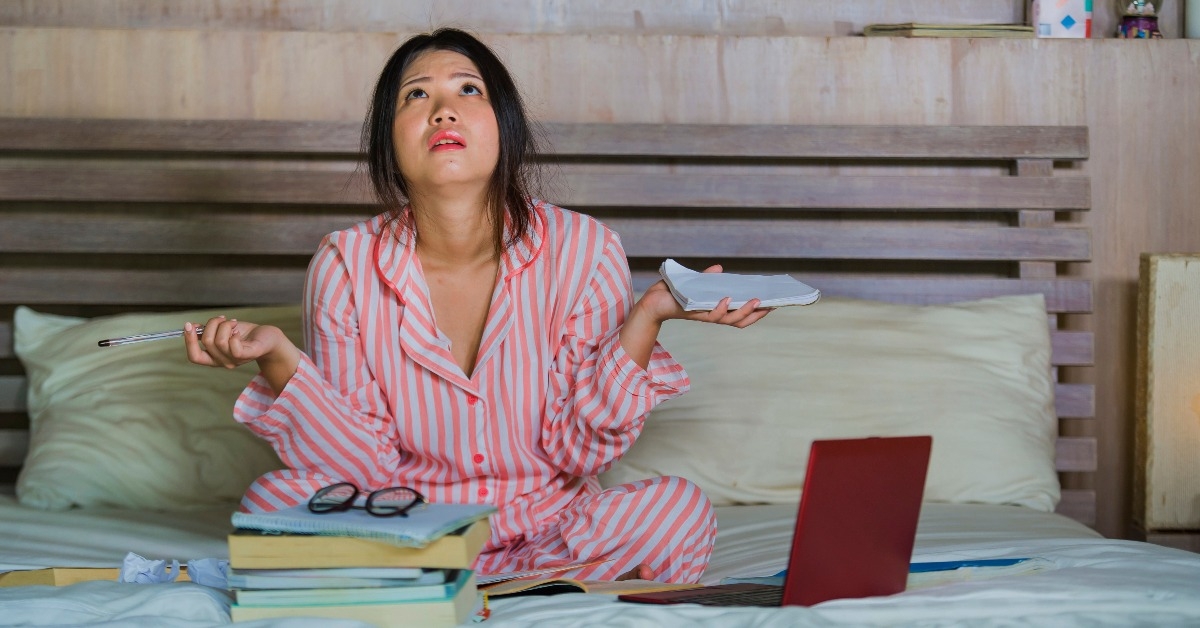 frustrated and tired Asian Japanese university student