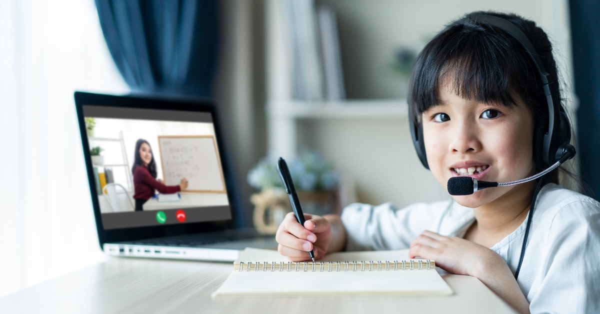 young girl learning with online tutor