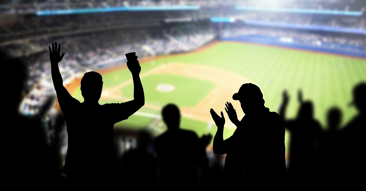 Baseball fans and crowd cheering in stadium and watching the game in ballpark