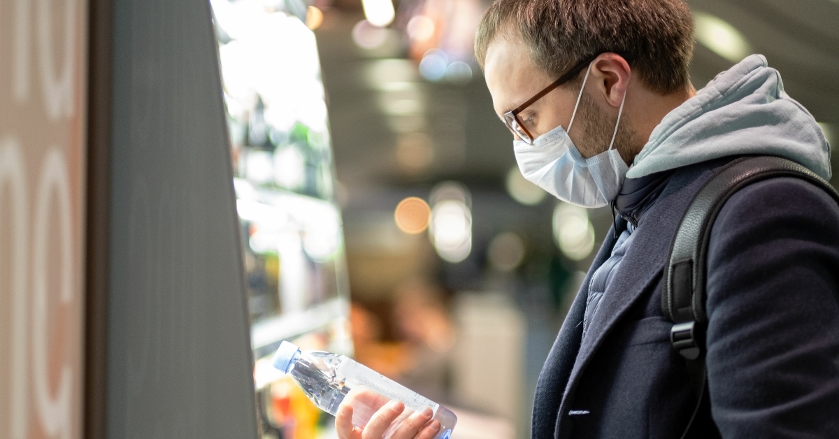 Man buying water bottle