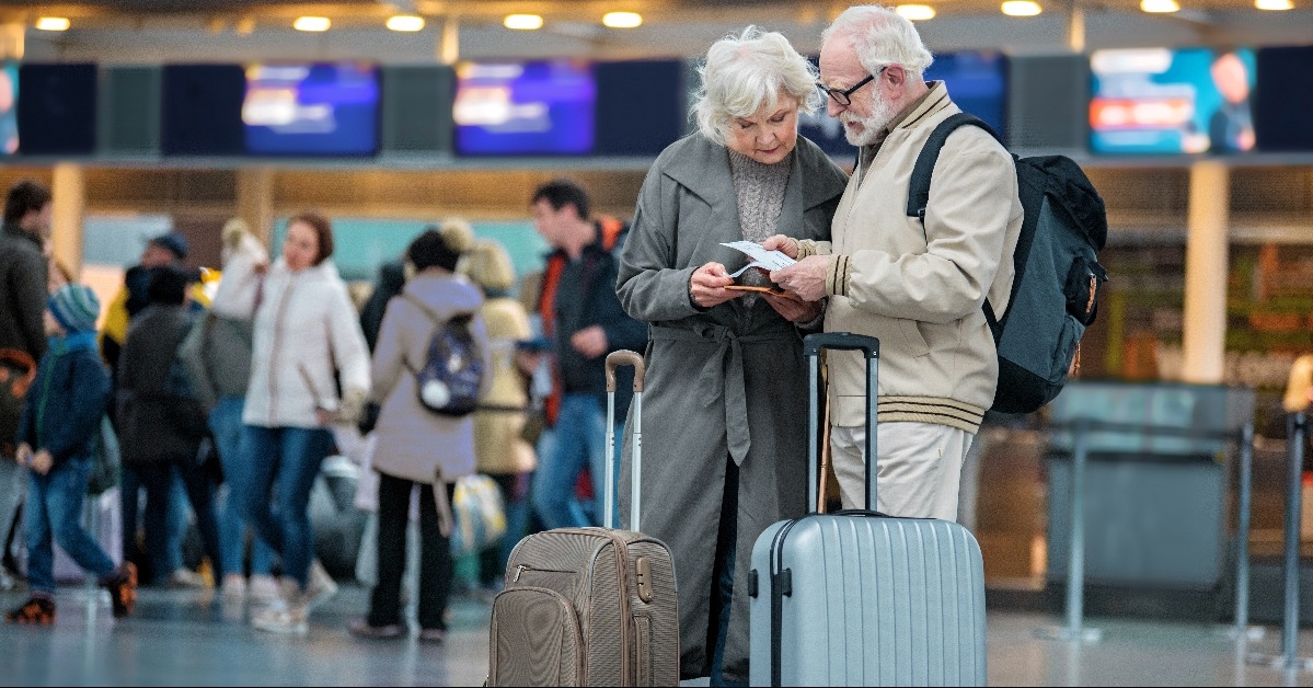 senior couple checking trip details