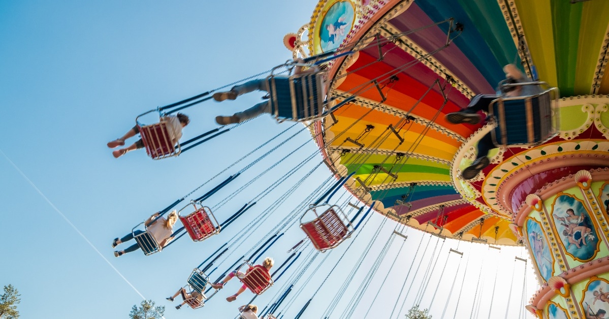 Ride Swing Carousel in motion in amusement park