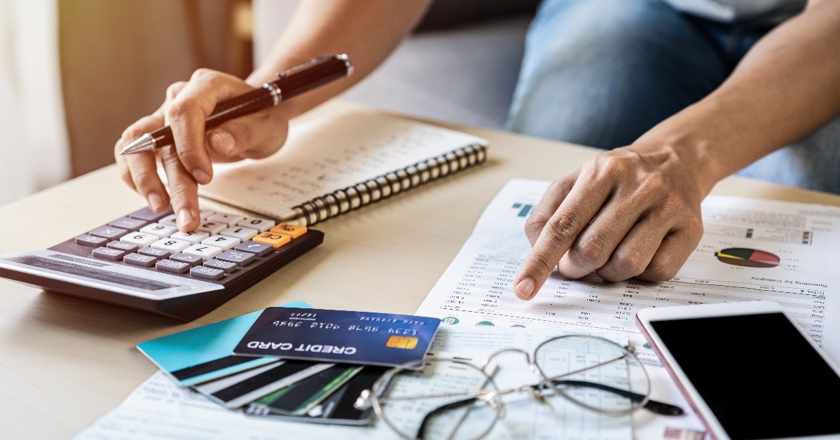 young woman checking bills