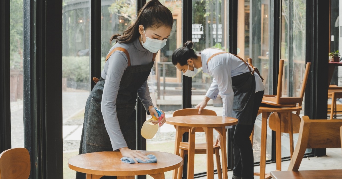 asian waitress staff wearing protection face mask 