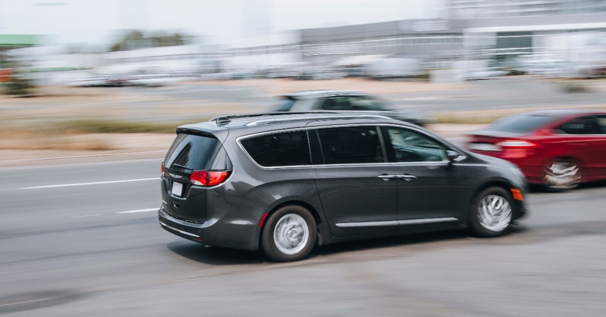 Black Chrysler Pacifica car moving on the street