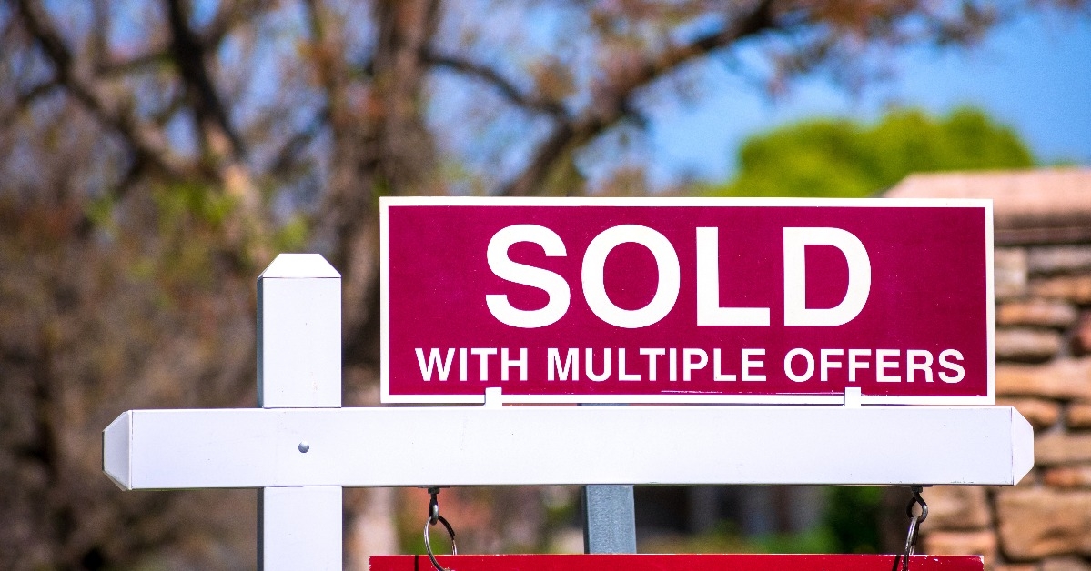 real estate sign near purchased house 