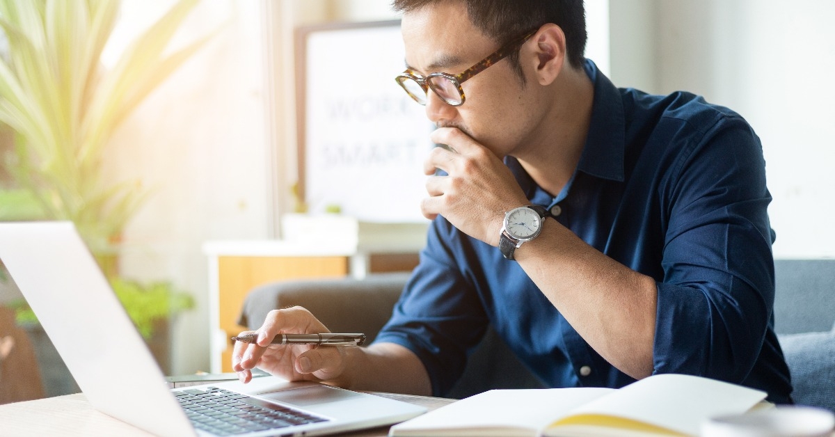 man thinking about investment plan