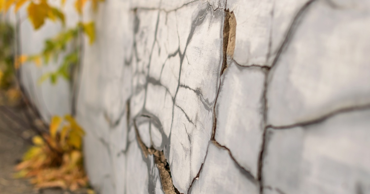 old foundation wall with cracks and chips