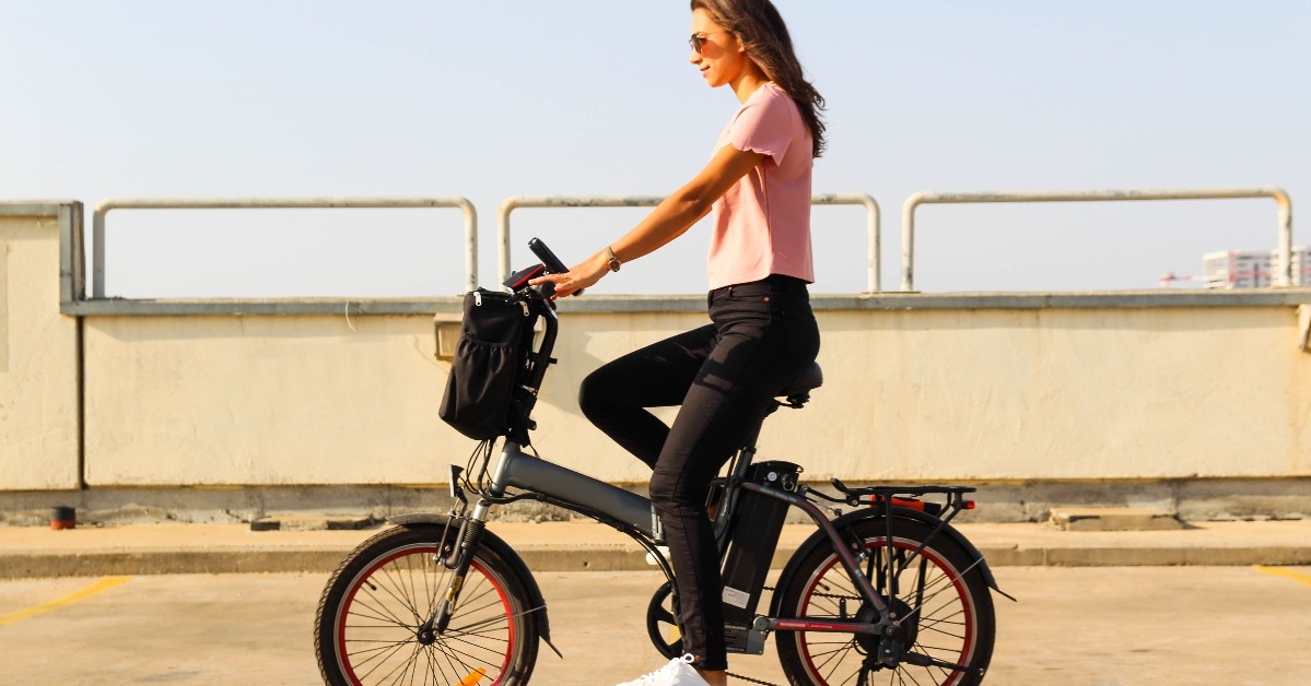 young woman riding an electric bicycle