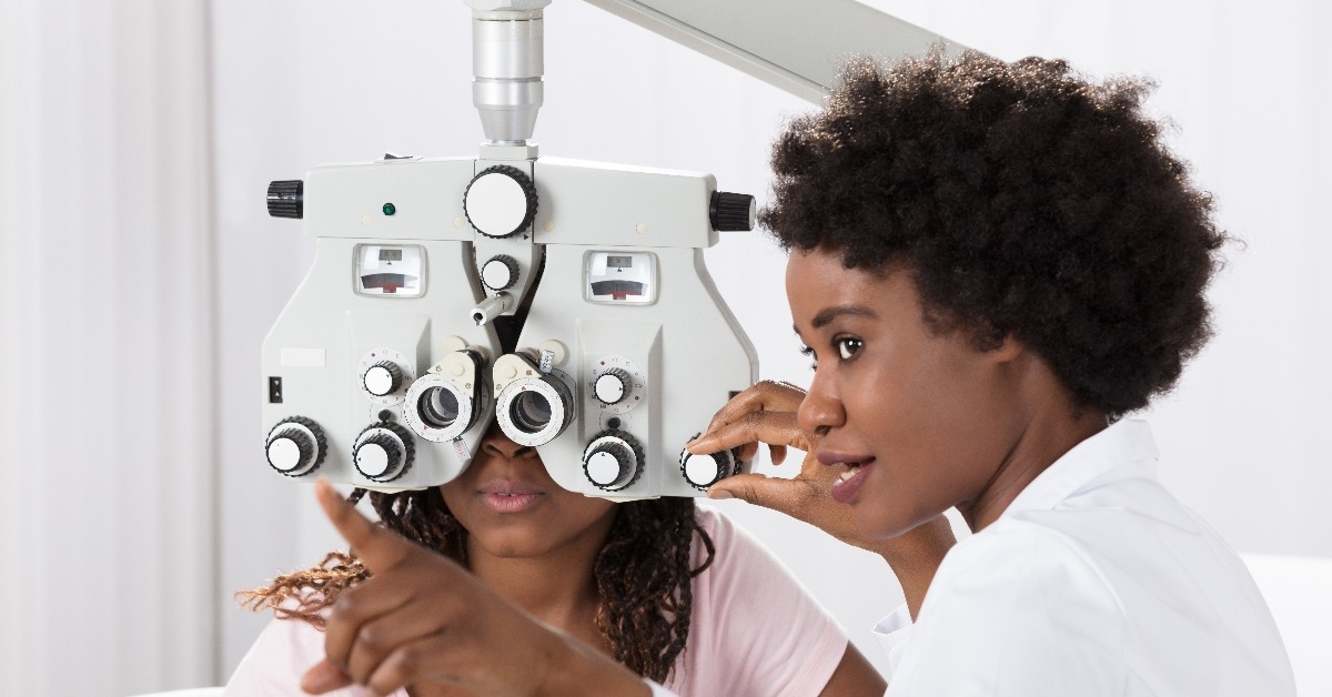 optometrist doing sight testing for patient