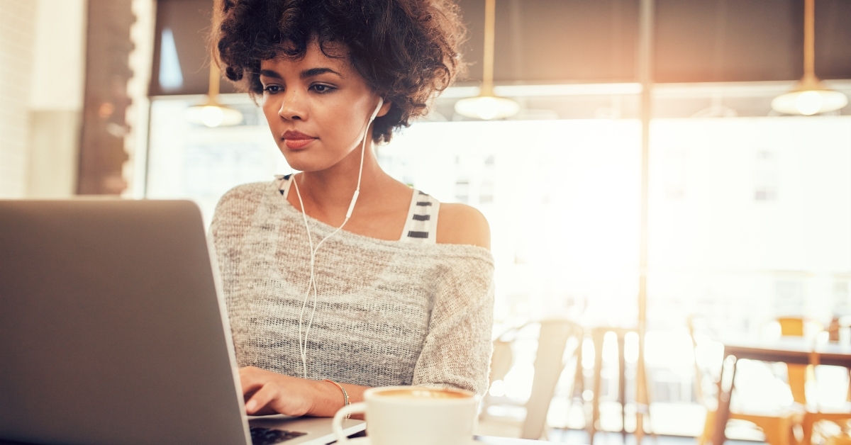 Woman on computer at coffee shop