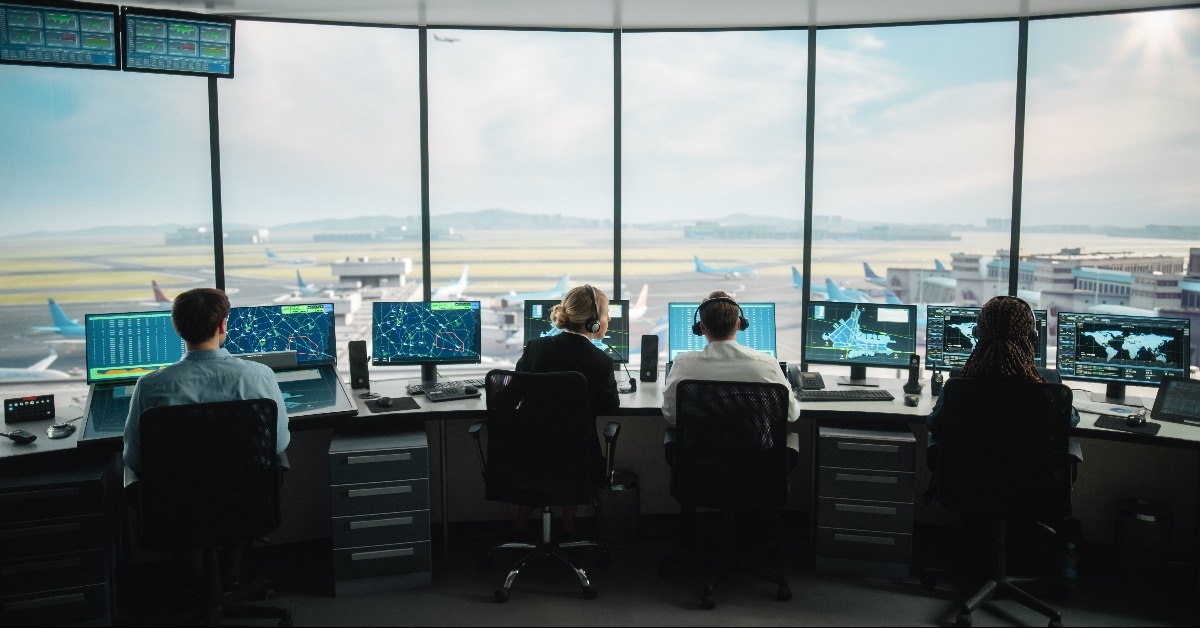 diverse air traffic control team working in a modern airport tower