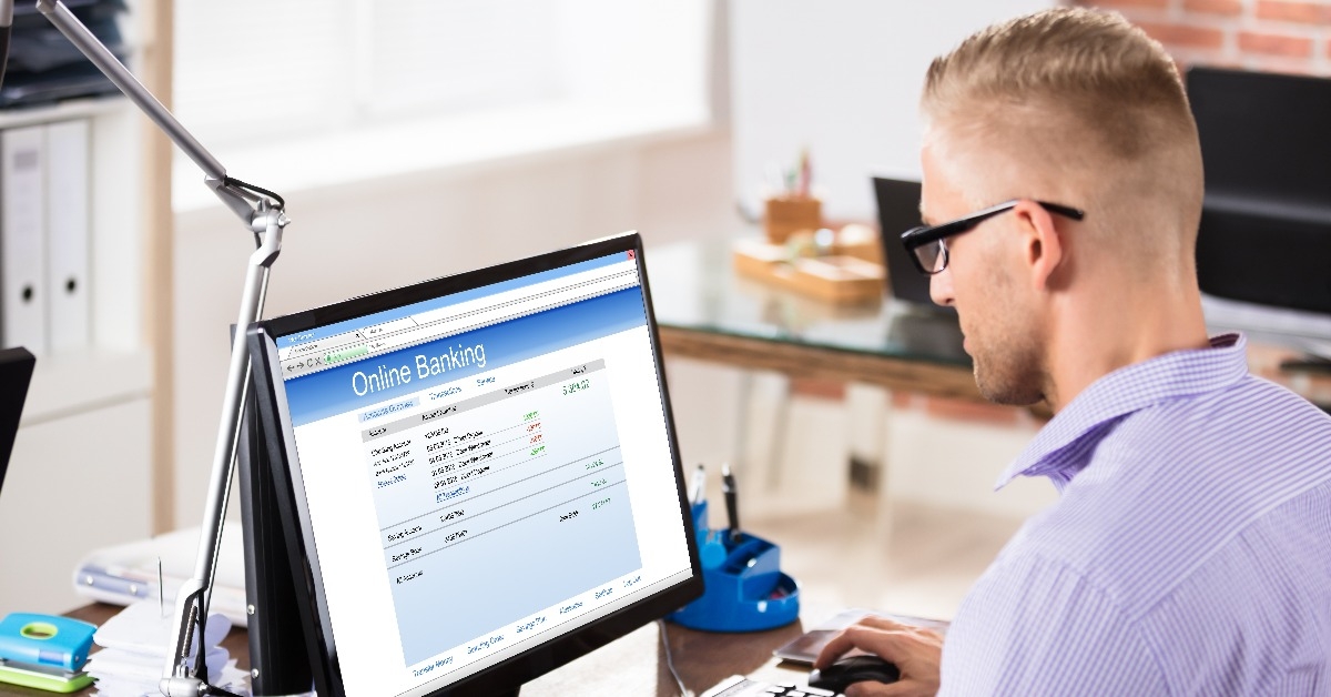 businessman doing online banking in office