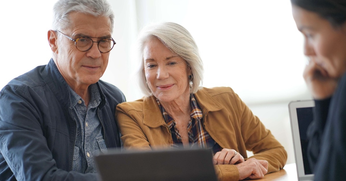 modern senior couple going through remodelling ideas on tablet
