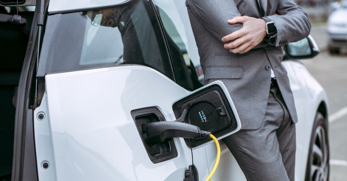 man charging eco car