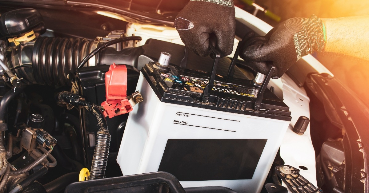  pulling up an car old battery for replacement