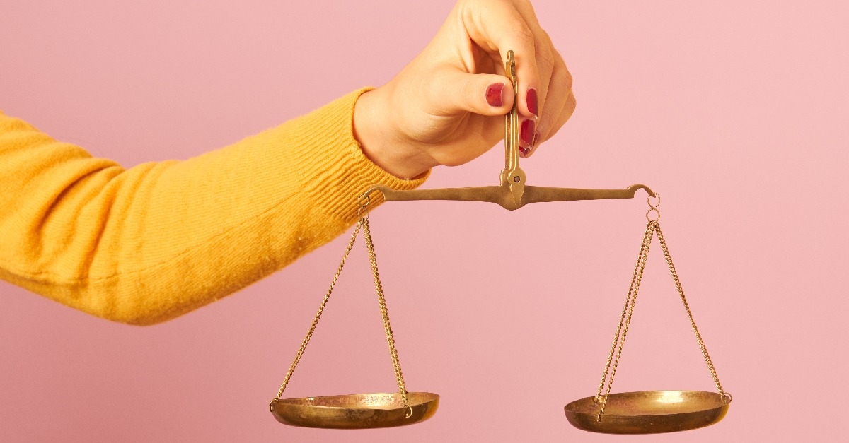 woman hand holding a balance