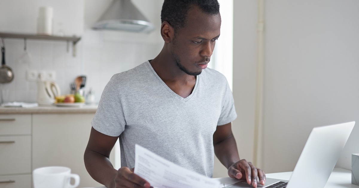  young african american student using online banking application 