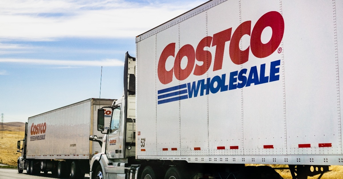 branded Costco Wholesale trucks driving on the freeway