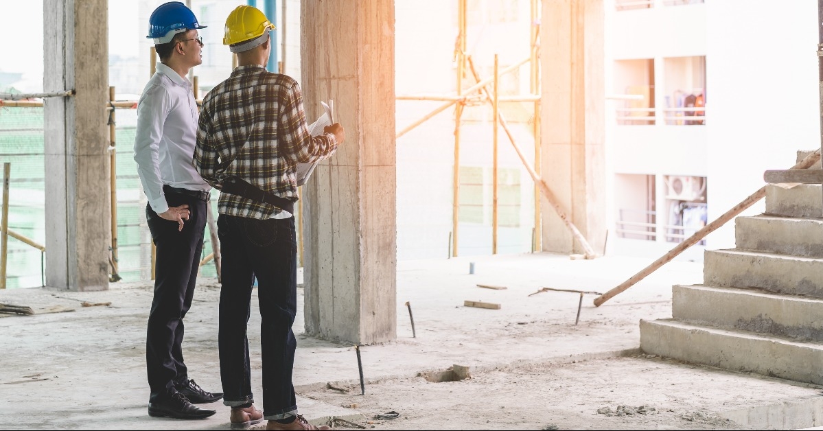 contractor and engineer inspecting material in construction building