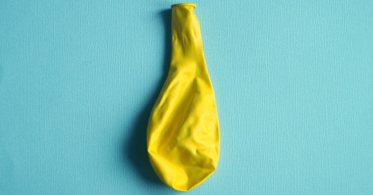 Deflated yellow balloon 