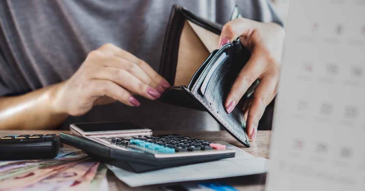 poor woman hand open empty purse looking for money