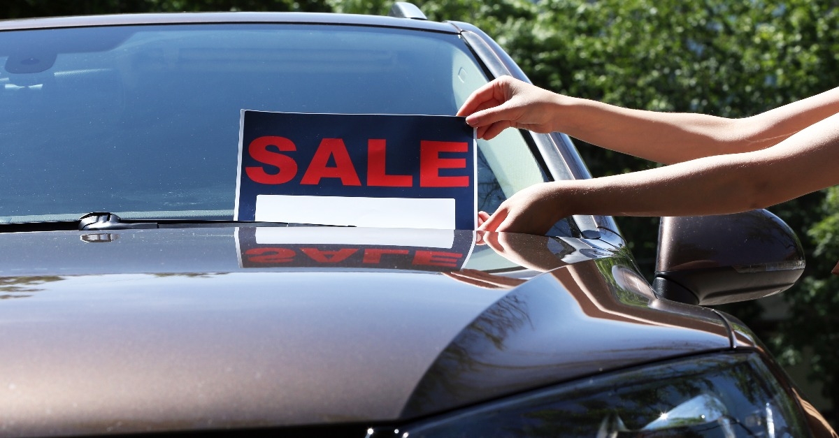 For sale sign on windshield of car