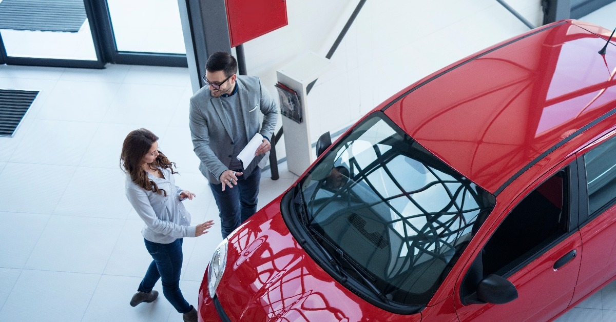 car dealer presenting new car