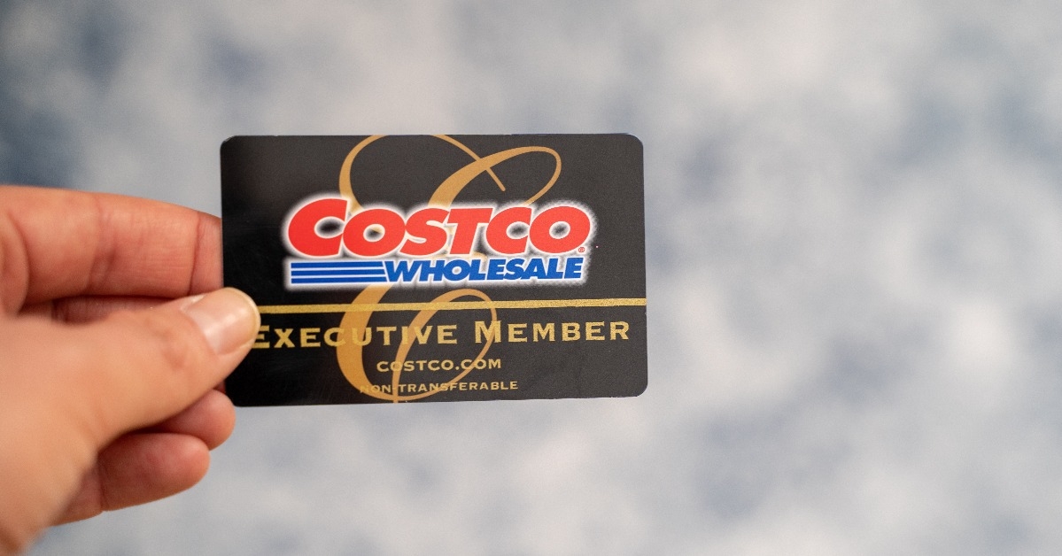 Hand holding a Costco Wholesale Executive Membership card