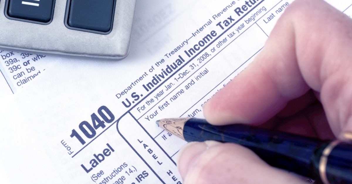 1040 Tax form with pen
