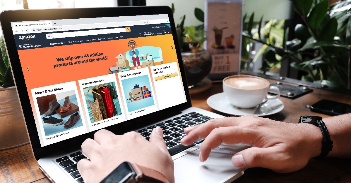 Laptop showing Amazon logo and credit card shopping online