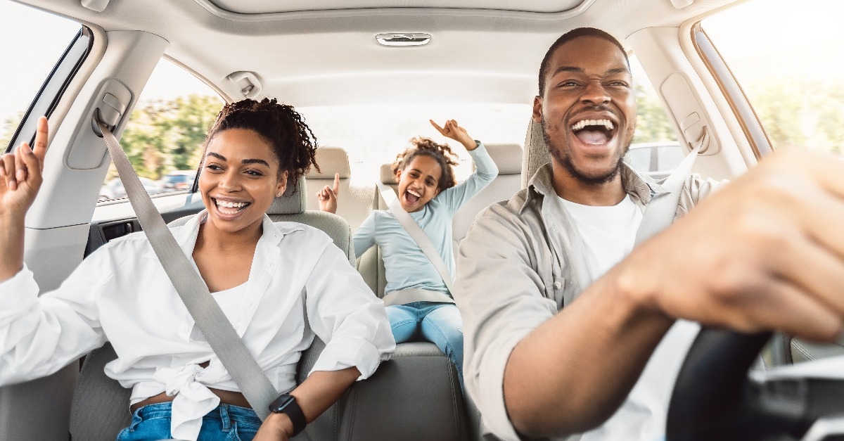 Happy Black Family Of Three Singing Having Fun Riding Car