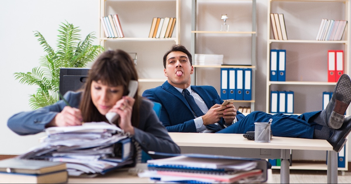 Male and female employees in office