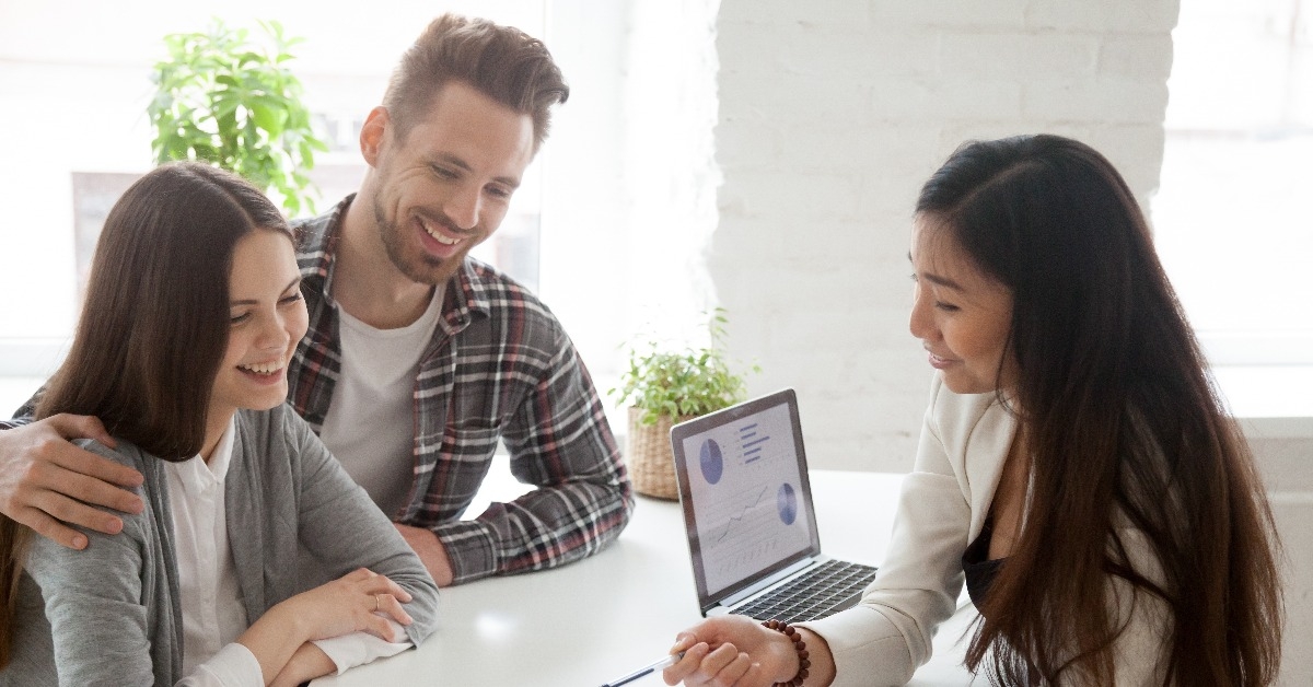 financial advisor consulting young millennial couple clients