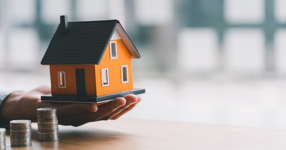 stack of money and home model