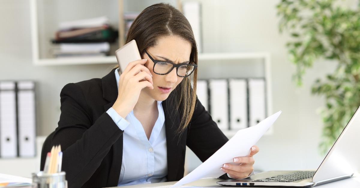 confused customer calling support service at office