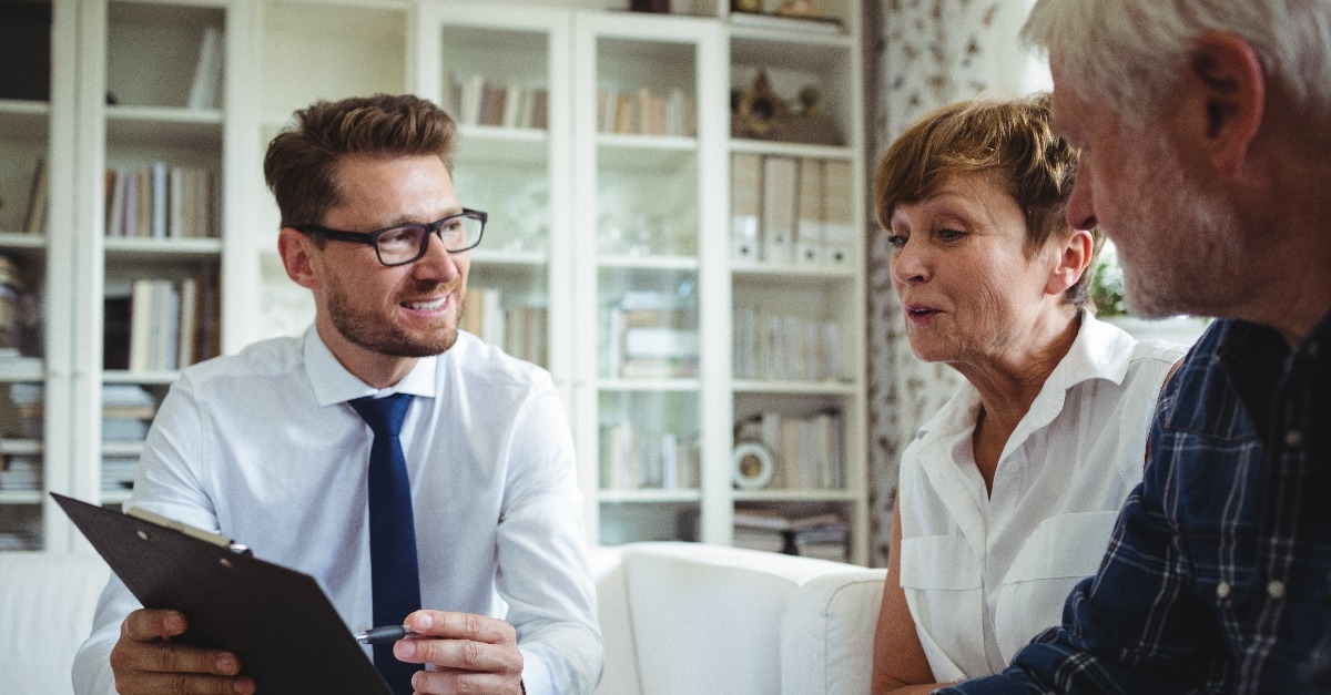 Senior couple planning their investments with financial advisor
