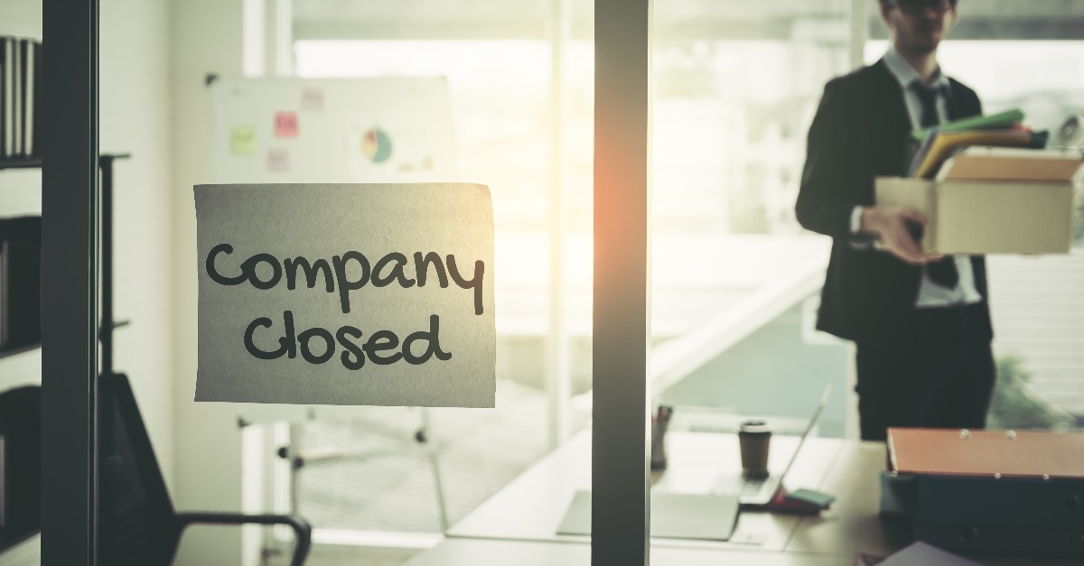 Company closed on windows of an empty office