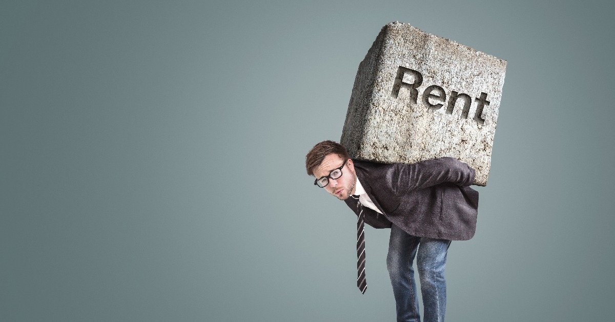 man burdened by high rent