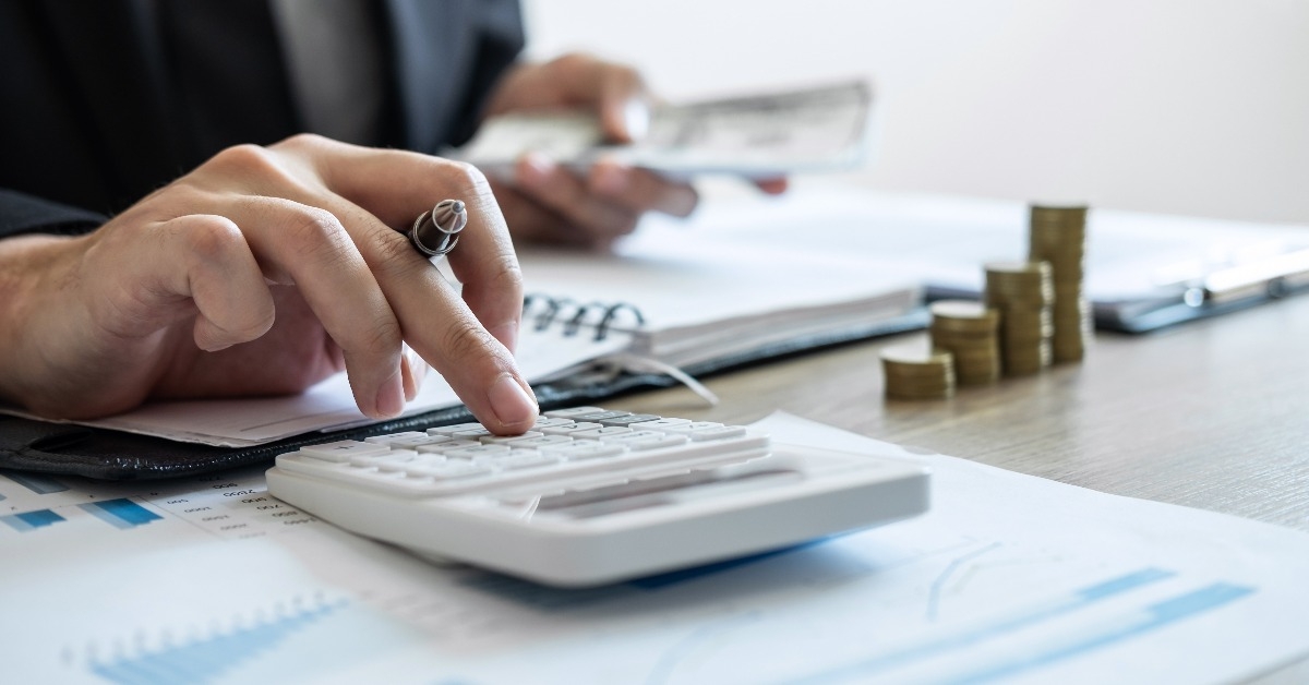  accountant counting money and making notes report doing finance