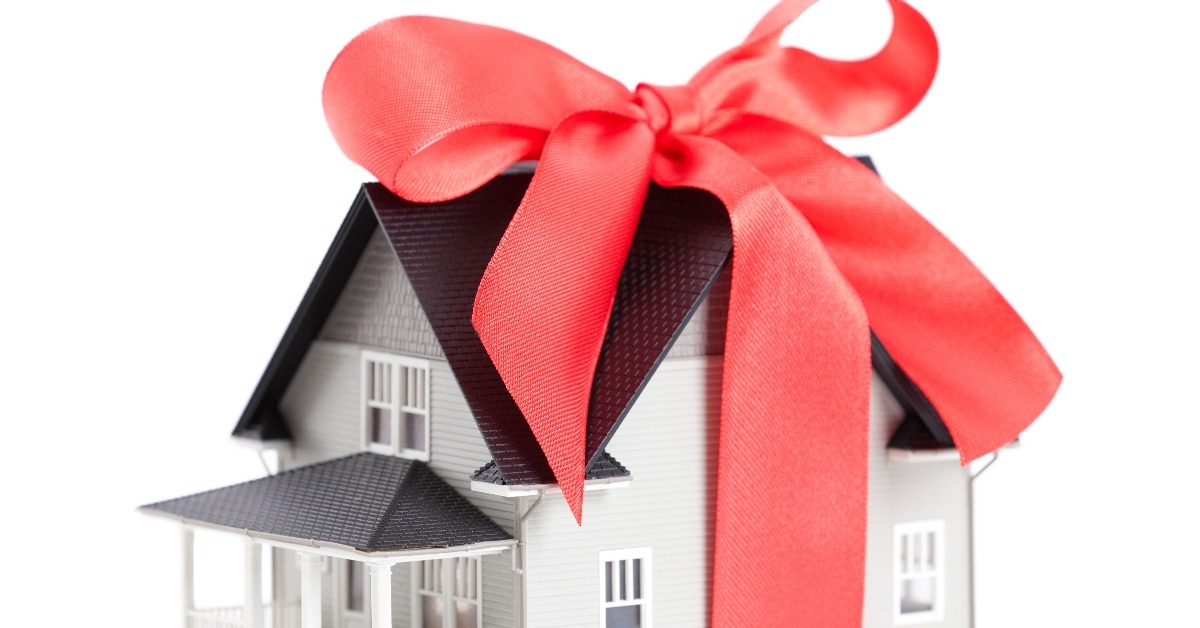 House architectural model with red bow