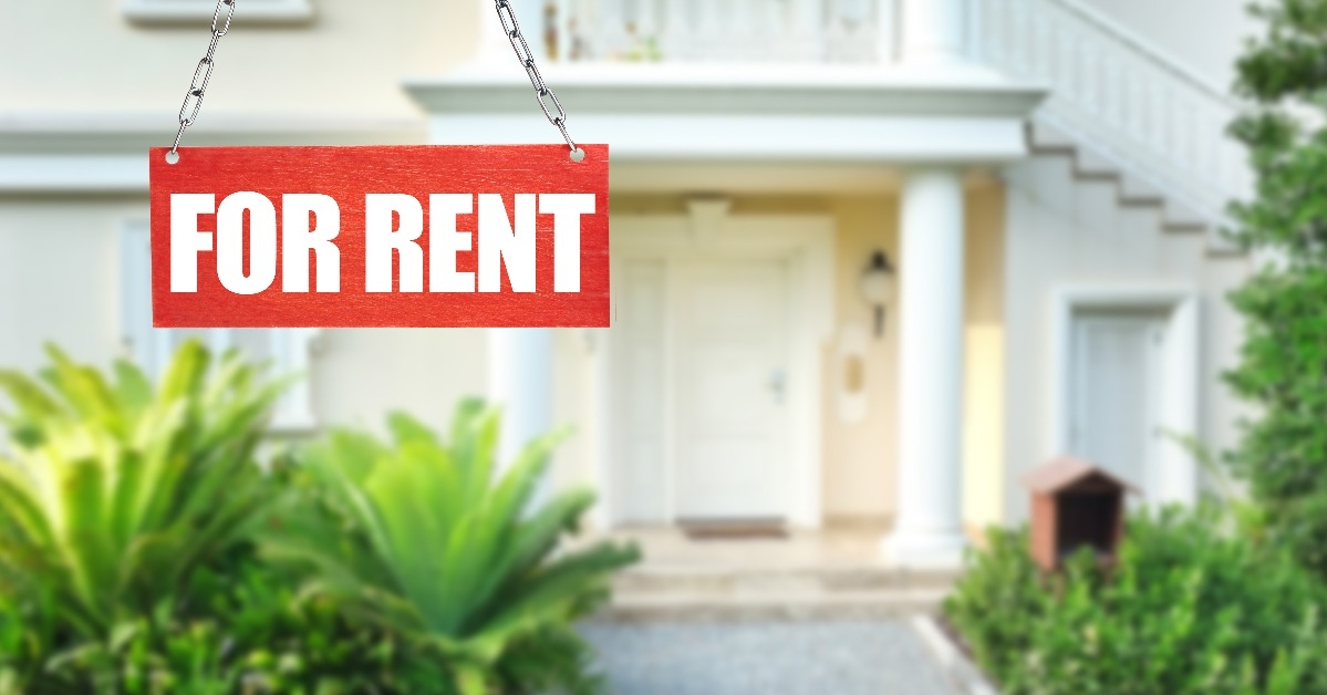 Real estate sign in front of new house for rent