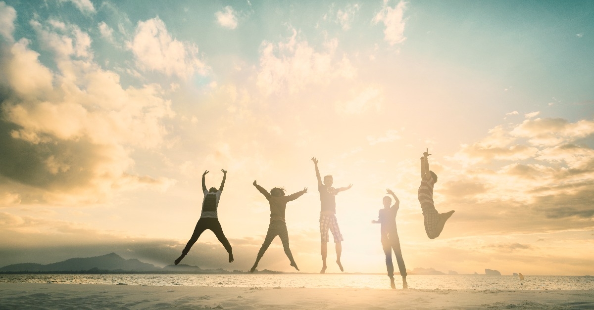 group of people jumping for good life on weekend